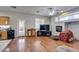 Living room boasts wood floors, fireplace, and access to the backyard at 1048 Painted Daisy Ave, Henderson, NV 89074