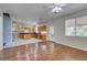 Open concept living room and kitchen with stainless appliances and ample cabinetry at 1048 Painted Daisy Ave, Henderson, NV 89074