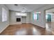 Light-filled living room has hardwood floors and a fireplace at 1048 Painted Daisy Ave, Henderson, NV 89074
