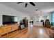 Bright living room featuring wood floors, stylish cabinets, and a modern aesthetic at 1048 Painted Daisy Ave, Henderson, NV 89074