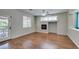 An inviting living room is highlighted by hardwood floors and a fireplace at 1048 Painted Daisy Ave, Henderson, NV 89074