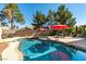 Sparkling backyard pool with inviting lounge area, ideal for outdoor entertaining and relaxation at 1048 Painted Daisy Ave, Henderson, NV 89074