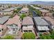 Aerial view of the neighborhood with a view of the surrounding mountains at 10713 Noble Mesa Ave, Las Vegas, NV 89166