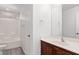 Bathroom features wooden vanity, a large mirror, modern fixtures, and a shower/tub combo at 10713 Noble Mesa Ave, Las Vegas, NV 89166