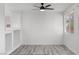 Spacious bedroom with ceiling fan, light wood flooring, and neutral walls at 10713 Noble Mesa Ave, Las Vegas, NV 89166