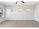 The spacious bedroom provides ample sunlight through three windows, creating a warm and inviting atmosphere at 10713 Noble Mesa Ave, Las Vegas, NV 89166