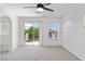 Bedroom with sliding glass doors to a balcony and carpeted floor at 10713 Noble Mesa Ave, Las Vegas, NV 89166