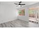 Bedroom with a sliding door to a balcony, ceiling fan, and natural light at 10713 Noble Mesa Ave, Las Vegas, NV 89166