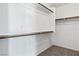 A well-organized closet with built-in shelving and wooden rods provides ample storage space at 10713 Noble Mesa Ave, Las Vegas, NV 89166