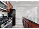 Modern kitchen featuring stainless steel appliances, granite countertops, and wooden cabinets at 10713 Noble Mesa Ave, Las Vegas, NV 89166