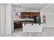 Open-concept kitchen design with stainless steel appliances, a breakfast bar, and an easy access layout at 10713 Noble Mesa Ave, Las Vegas, NV 89166