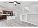 Open living space combining the kitchen, dining, and staircase at 10713 Noble Mesa Ave, Las Vegas, NV 89166