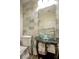Half bath features elegant fixtures, a stylish vanity, and unique tiling at 1125 Via Canale Dr, Henderson, NV 89011