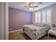 Inviting bedroom featuring a queen-sized bed, shutters, and neutral tones for a calming retreat at 1125 Via Canale Dr, Henderson, NV 89011