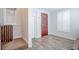Inviting foyer with a wood door and staircase at 1125 Via Canale Dr, Henderson, NV 89011