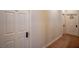 Hallway features a guest room and laundry room access. Interior of home at 1125 Via Canale Dr, Henderson, NV 89011