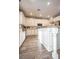 This kitchen features an island with granite countertops, stainless steel appliances, and custom cabinets at 1125 Via Canale Dr, Henderson, NV 89011