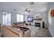 Spacious living room showcasing recessed lighting, two leather couches, and a shiplap accent wall at 1125 Via Canale Dr, Henderson, NV 89011