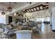 Spacious lobby with stylish seating, elegant lighting fixtures, and a cozy fireplace at 1125 Via Canale Dr, Henderson, NV 89011
