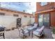 Cozy patio with a stylish fountain, comfortable seating, and outdoor grill, perfect for outdoor gatherings at 1125 Via Canale Dr, Henderson, NV 89011