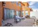 Inviting outdoor patio area with comfortable seating and string lights, perfect for relaxing and entertaining at 1125 Via Canale Dr, Henderson, NV 89011