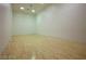 An indoor racquetball court features a hardwood floor and clean white walls, ready for a game at 1125 Via Canale Dr, Henderson, NV 89011