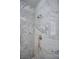 Marble shower with bronze shower head and faucets and a built in shelf at 1125 Via Canale Dr, Henderson, NV 89011