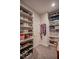 Custom shelving provides abundant space for shoes, bags and folded clothing in this walk-in closet at 1125 Via Canale Dr, Henderson, NV 89011