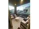 Relaxing outdoor balcony with seating, a modern accent table, and views of the surrounding neighborhood at 11257 Rainbow Peak Ave # 201, Las Vegas, NV 89135