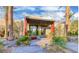 Beautiful clubhouse entrance with desert landscaping and contemporary design at 11257 Rainbow Peak Ave # 201, Las Vegas, NV 89135