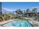 Relaxing hot tub area with shaded seating, landscaping, and community amenities at 11257 Rainbow Peak Ave # 201, Las Vegas, NV 89135