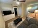 Cozy living room with comfortable seating, a media console, and unique decor elements at 11257 Rainbow Peak Ave # 201, Las Vegas, NV 89135
