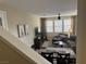 Inviting living room featuring comfortable seating, neutral tones and decor, and plenty of natural light from the windows at 11257 Rainbow Peak Ave # 201, Las Vegas, NV 89135