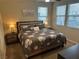Serene main bedroom with a comfortable king bed, bedside tables, and plenty of natural light from the windows at 11257 Rainbow Peak Ave # 201, Las Vegas, NV 89135