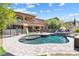 Beautiful backyard featuring a sparkling pool, spa, playset and outdoor living spaces at 12254 Cape Cortez Ct, Las Vegas, NV 89138