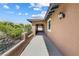 Outdoor balcony area with covered archway and black metal railing with pool view at 12254 Cape Cortez Ct, Las Vegas, NV 89138
