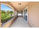 A covered balcony with wrought iron railings overlooks lush landscaping and offers outdoor living space at 12254 Cape Cortez Ct, Las Vegas, NV 89138