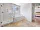 Bright bathroom boasts separate shower and tub, tiled floor, and a serene ambiance at 12254 Cape Cortez Ct, Las Vegas, NV 89138