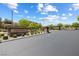 A community entrance with stone signage and manicured landscaping at 12254 Cape Cortez Ct, Las Vegas, NV 89138