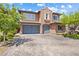 Charming two-story home with a paver driveway, three-car garage and mature landscaping at 12254 Cape Cortez Ct, Las Vegas, NV 89138