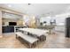 Open-concept kitchen and living room with modern lighting, stainless steel appliances, and lots of space at 12254 Cape Cortez Ct, Las Vegas, NV 89138