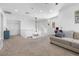 Spacious living area with modern staircase, comfortable sofa, and abundant natural light at 12254 Cape Cortez Ct, Las Vegas, NV 89138