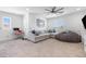Comfortable living room features a cozy sofa, a beanbag, and a desk for work at 12254 Cape Cortez Ct, Las Vegas, NV 89138