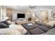 Spacious living room boasts a decorative accent wall, tile flooring, and modern furnishings at 12254 Cape Cortez Ct, Las Vegas, NV 89138