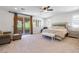 Serene main bedroom with balcony access, plantation shutters, and a luxurious bed at 12254 Cape Cortez Ct, Las Vegas, NV 89138