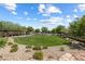A serene community park offers a well-maintained lawn, walking paths, and beautiful landscaping at 12254 Cape Cortez Ct, Las Vegas, NV 89138