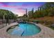 Sparkling private pool with stone surround, integrated spa, and privacy landscaping at 12254 Cape Cortez Ct, Las Vegas, NV 89138