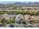 Overhead aerial shot showcases a neighborhood with mature trees, palm trees and well-kept homes at 129 Sapodilla Ln, Las Vegas, NV 89144