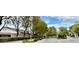 View of the Belvedere community entrance, sign and gated entry surrounded by greenery at 129 Sapodilla Ln, Las Vegas, NV 89144