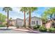 Lovely home with palm trees, xeriscape landscaping, and a two-car garage at 129 Sapodilla Ln, Las Vegas, NV 89144